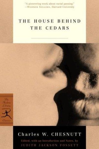 The house behind the cedars